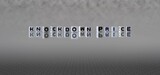 Fototapeta  - knockdown price word or concept represented by black and white letter cubes on a grey horizon background stretching to infinity