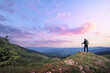 © luengo_ua - Active lifestyle. Traveling, hiking and trekking concept. Young woman with backpack in the Carpathian mountains on sunset.