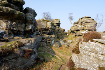 Wall Mural - Narrow path between weathered gritstone rocks