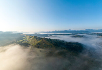 Wall Mural - Ukrainian Carpathians mountains on a summer morning. Aerial drone view.