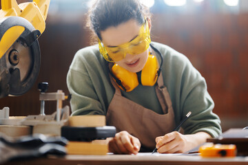 Canvas Print - woman carpenter in workshop