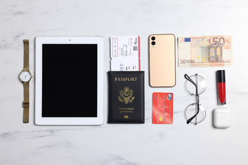 Poster - Flat lay composition with documents, money and accessories on white marble background. Packing for business trip