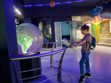 Yong School Boy Enjoy Play And Learn With Science Learning Activities At The Space And Earth Evolution Museum On Weekends, Novosibirsk - Russia, 6 April 2022