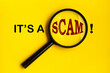 It's a scam text on yellow cover with magnifying glass. Scamming concept