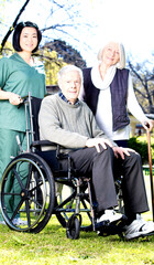 Poster - Elder people with wheelchair assisted by nurse outdoor