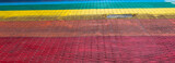 Fototapeta Tęcza - A fragment of the street paved in the colors of the rainbow