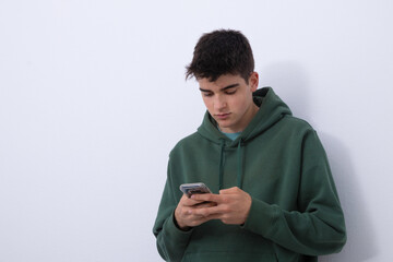 Poster - isolated teen boy looking at mobile phone