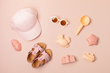 Kids summer accesories for sunny days and vacations. Sunglasses, sandals, sand molds for beach fun time