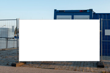 Blank white banner for advertisement on the fence of construction site