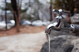 Fototapeta Kosmos - Faucet with running water in the park.
