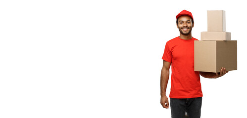 Poster - Delivery Concept - Portrait of Happy African American delivery man in red cloth holding a box package. Isolated on white studio Background. Copy Space