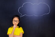 © Creativa Images - Female student standing with empty speech bubble
