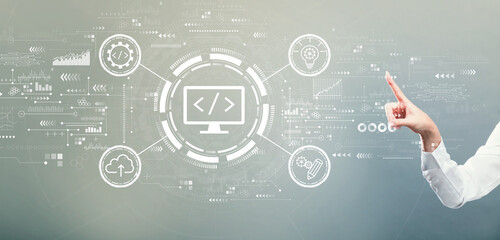 Web development concept with hand pressing a button on a gray background