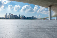 Empty Square Floor And City Skyline With Bridge Building In Hangzhou, China.