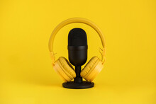 Microphone And Headphones On Yellow Background
