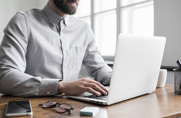 Man hands typing on computer keyboard closeup, businessman or student using laptop at home, online learning, internet marketing, working from home, office workplace, freelance concept