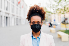 Businesswoman Wearing Protective Face Mask For Smog