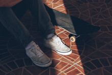 Sunlight On Man's Shoe And Skateboard