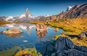 Exotic summer scene of Stellisee lake. Superb morning view of Matterhorn (Monte Cervino, Mont Cervin) in Swiss Alps, Zermatt location, Valais canton, Switzerland, Europe.