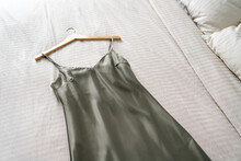 Green nightgown on bed at home