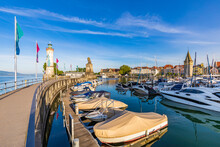 Germany, Bavaria, Lindau, Boats Moored In Harbor On Shore Of Lake Constance