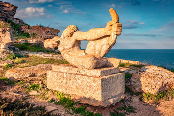 Monument to the defenders of the Cape and Kaliakra Fortress. Sunny morning scene of Bulgaria, Europe. Aerial spring seascape of Black sea.