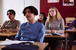 © Johnér - Teenage boy sitting in classroom