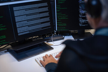 Male programmer working on computer