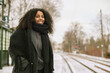 © Johnér - Woman at train station platform looking at camera