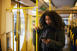 © Johnér - Woman in bus using cell phone
