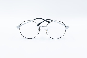 Isolated white background, Selective focus round eyeglasses with silver rim.