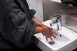 © Johnér - Mid section of woman washing hands