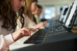 © Johnér - Teenage girl attending keyboard lesson