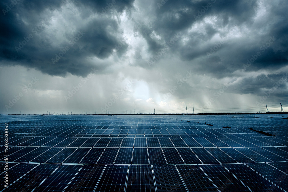 Photovoltaic modules solar power plant on dramatic sky background ...