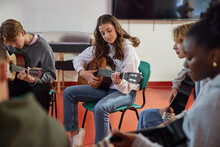 Teenagers Attending Guitar Lesson