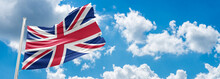 Waving The Flag Of The United Kingdom. Illustration Of A European Country Flag On A Flagpole In Red And White Colors.uk Flag