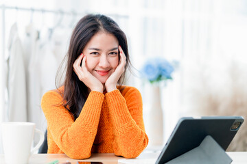 cute smiling asian female young adult look at camera hand hold herself face with cheerful and happiness,asia woman stay home casual relax working from home peaceful and leisure moment