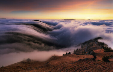 Wall Mural - Colorfull sunset behind Mountain peak landscape above clouds - panorama