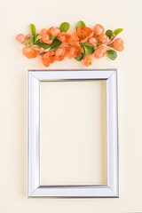 Wall Mural - beautiful flower arrangement. Bright orange flowers, empty photo frame for text on a light pastel background. Wedding. birthday. Valentine's Day. mothers Day. top view, copy space