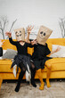© zzzdim - Scary little girls in halloween costumes wearing paper bags with scary faces