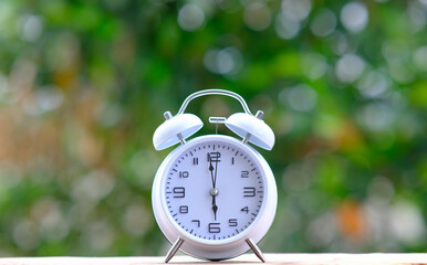 Canvas Print - Alarm clock on desk table background