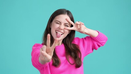 Wall Mural - Good mood nice lady make v sign weekend isolated cyan color background