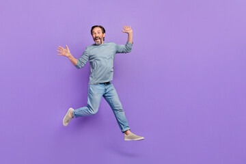 Poster - Full body photo of cheerful aged man have fun jumper wear casual clothes isolated over purple color background