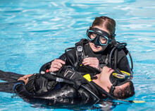 Scuba Diving Rescue Course Surface Skills Removing Gear Of Unconscious Diver