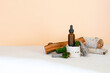 Glass dropper brown bottle cosmetic oil,cream, essential, serum on wooden stump podium,bark tree,green moss. Concept of natural organic eco spa cosmetics, medicine.Herbal homeopathic products mockup