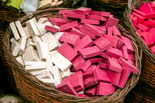 Natural, Handmade Scented And Hygienic Soaps, White And Pink Soaps Are Exhibited In A Wooden Box.