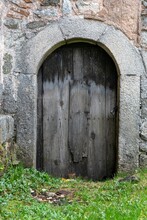 An Old Wooden Door To The Basement Of A Church