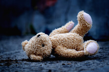 Conceptual Photography: War, Death And Lost Childhood. Conceptual Picture Of A Children's Toy Teddy Bear. Horizontal Image.