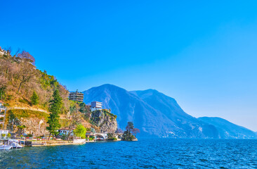 Poster - The view on the rocky shore of Lugano Lake with hilly residential houses of Castagnola-Cassarete district of Lugano, Switzerland