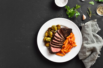 Grilled beef steak with brussels sprouts and sweet potatoes